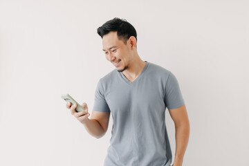 Happy Asian man use smartphone isolated on white background.