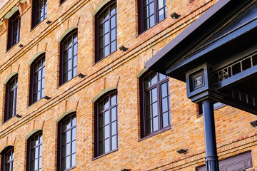 Detail of the facade of a modern loft-style office building, rebuilt from an old steam mill. The picture was taken in Russia, in the city of Orenburg