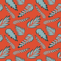 Seamless pattern with leaves on orange background