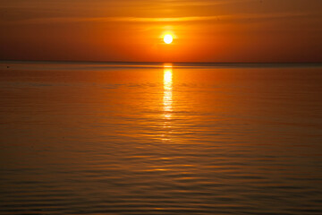 Summer sunset at sea. A resort place to relax at sunset. text place.