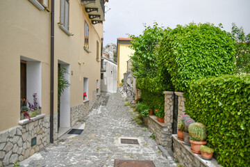 A small street between the old houses of Pietrabbondante, a medieval village in the mountains of the Molise region in Italy.