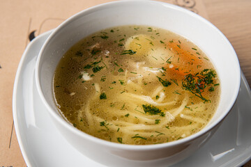 chicken broth in a white plate
