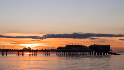 Sunset behind Cromer Pier