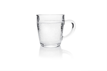 Transparent mug with effervescent water isolated on white.
