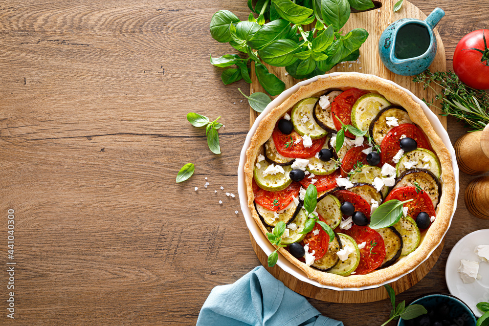 Canvas Prints vegetable tart with zucchini, aubergine, tomato, olives and feta cheese, top view