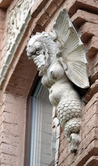 Sculpture of the Griffin on the facade of the building