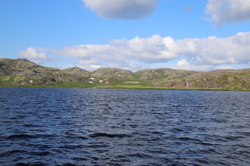 blue waters of the northern lake on the background of the tundra
