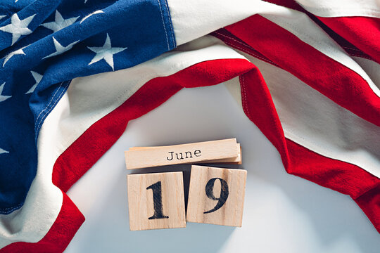 Cute wooden blocks calendar with June, 19 date. Juneteenth National Independence Day concept