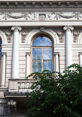 Facade of an old building with a balcony