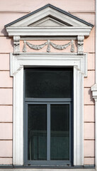 Fototapeta na wymiar Facade of an old building with a window