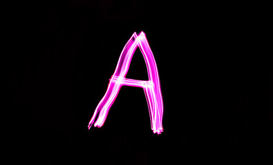 Neon letter A, pink long exposure light writes A,