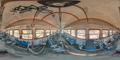 Spherical panoramic photograph of the inside of an old train carriage