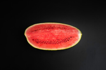 Fototapeta na wymiar slices of watermelon isolated on black background