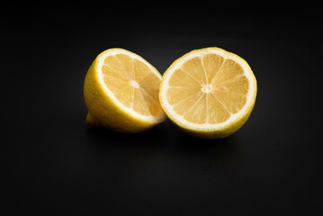 bright lemon yellow juicy fruit on a dark background