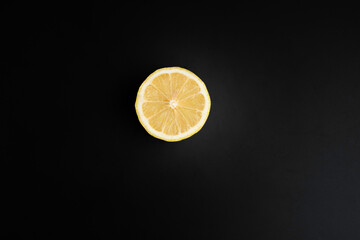 bright lemon yellow juicy fruit on a dark background