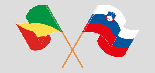 Crossed and waving flags of Republic of the Congo and Slovenia