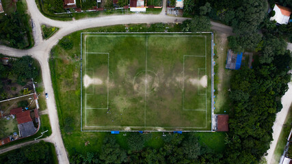 top view of a team training in a grass soccer field in brasil	