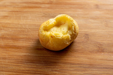 Brazilian snack cheese bread on wooden background.