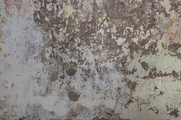 The texture of a worn out, old concrete wall.