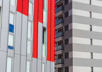 Modern and avant-garde buildings, with straight lines, and red and gray colors.