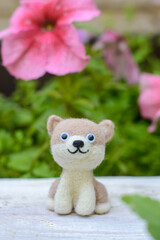 Fototapeta premium Toy handmade woolen dog, felting