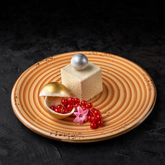 Modern mousse cake covered with White chocolate velour. Dessert French cuisine