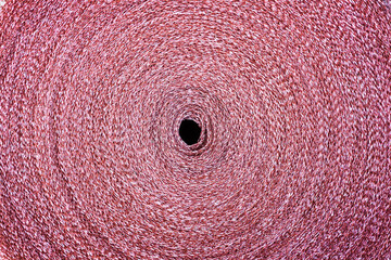 Copper mesh, twisted into a roll, top view.