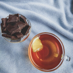 black bitter chocolate with black tea with lemon delight on a blue background