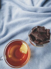 black bitter chocolate with black tea with lemon delight on a blue background