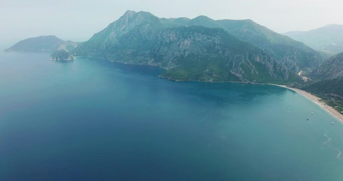 Aerial drone of Cirali beach and Olympos Olimpos mountain in a beautiful day light. Kemer, Antalya, Mediterranean region, Turkey, Lycia. Perfect sea view, nice for eyes of traveler.