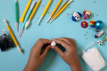 making a figurine of a white tiger from plasticine step by step instructions, step 1.