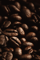 close up dark roasted coffee beans on heap, Low light picture style and showing detail with texture