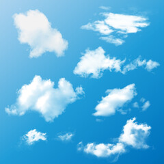 Obraz na płótnie Canvas Realistic set of white fluffy summer clouds on a blue background