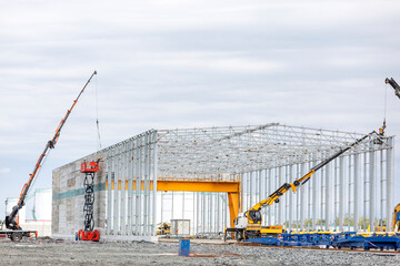 Typical new steel structure building of factory. A steel building is a metal structure fabricated...