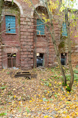 Abandoned brick factory in autumn forest