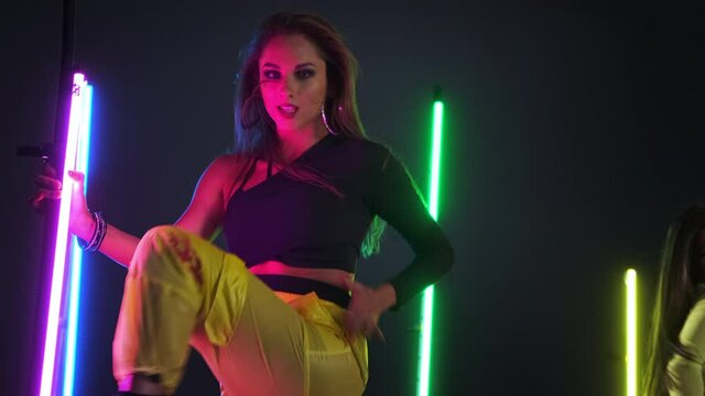 Expressive dancing in neon lighting