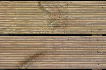 Wooden planks with stain and texture and narrow dark gaps