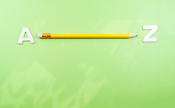 Pencil showing the distance from A to Z on a green surface