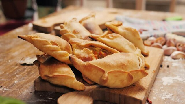 Man Cooking Empanadas Argetinian Pie, Traditional Bakery From Argentina, Chef Filling Dough In Home With Meat And Vegetables, Homemade Spanish Empanadas