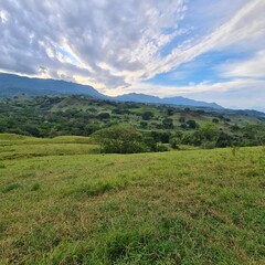 Rural landscape with trees and cloudy sky. Tamesis, Antioquia, Colombia.