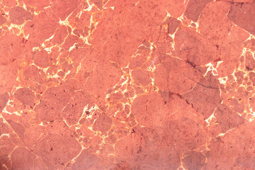 Red marble wall with scratches. Background, texture