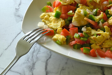Close-up of Mexican eggs on marble table, with copy space