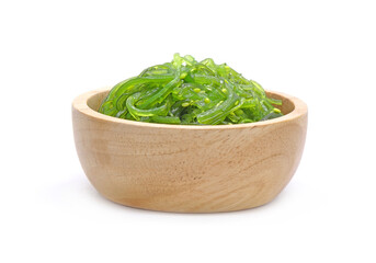 Chuka Wakame Salad in wooden bowl isolated on white background. Famous Japanese appetizer