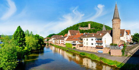 Cityscape of Gemünden with Main river, Hexenturm and Scherenburg ruin on the hill, Bavaria, Germany