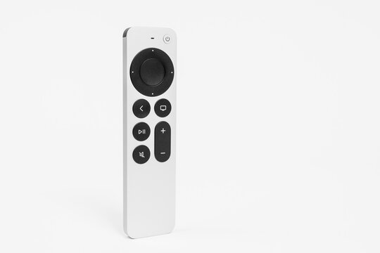 RUSSIA ROSTOV - MAY 29 2021: New unpacked Siri Remote control with a touch-enabled clickpad for Apple TV 4K console standing vertically on a white background, front view, copy space.
