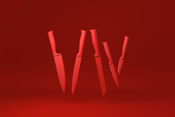 Red Kitchen knives floating in Red background. minimal concept idea creative. monochrome. 3D render.