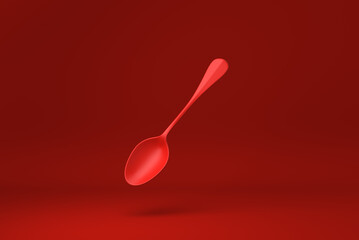 Red spoon floating in Red background. minimal concept idea creative. monochrome. 3D render.