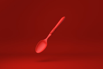 Red spoon floating in Red background. minimal concept idea creative. monochrome. 3D render.