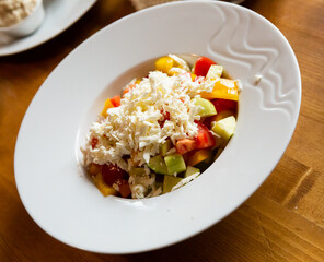 Vegetable salad with fresh tomatoes, cucumbers, bell pepper and feta cheese