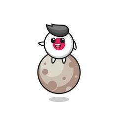illustration of japan flag badge cartoon sitting on the moon